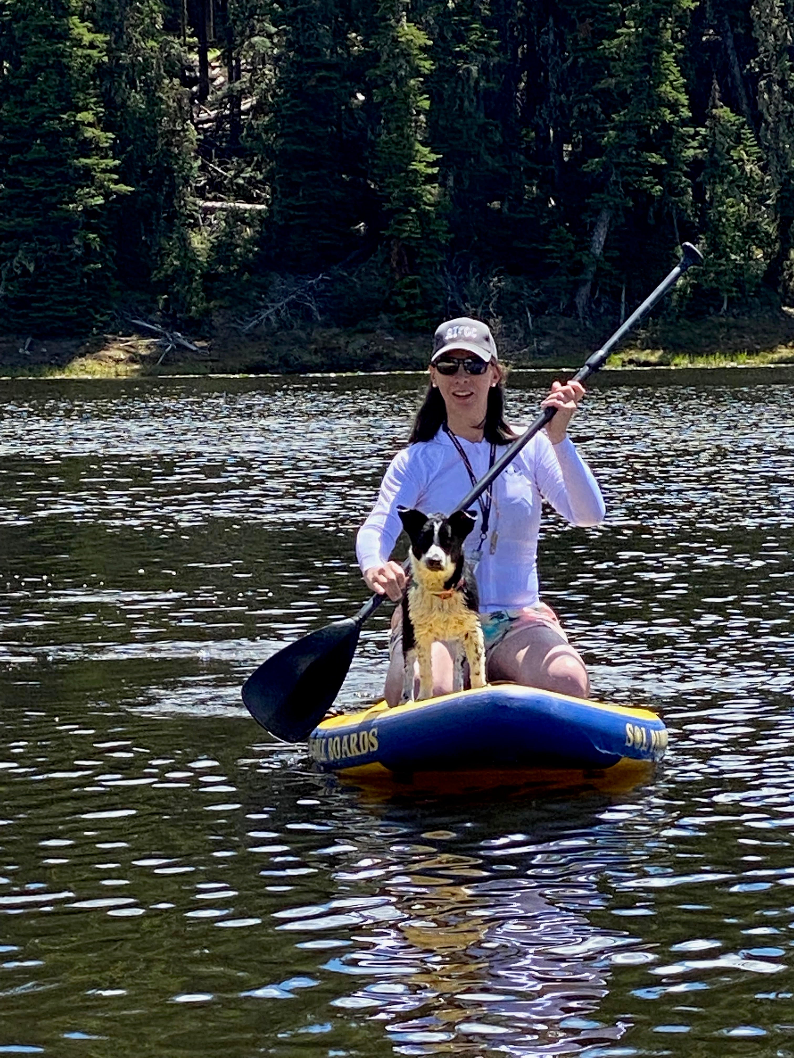 Photo of Emily Leproust, Co-founder and CEO of Twist Bioscience, in a kayak with her dog