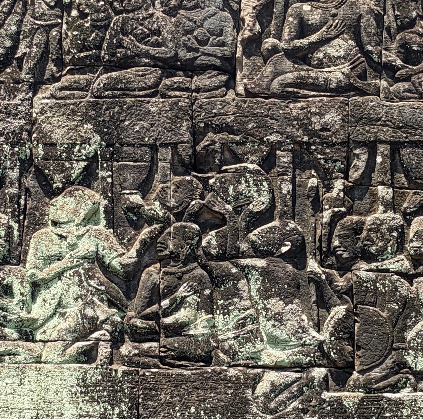A bas-relief from the Bayon temple depicting the decapitated heads of the rebel leaders from Malyang being presented to King Jayavarman VII