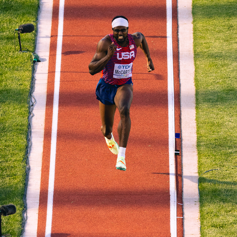 Man running on track.
