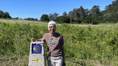 Laura Pulido stands next to a historical marker.