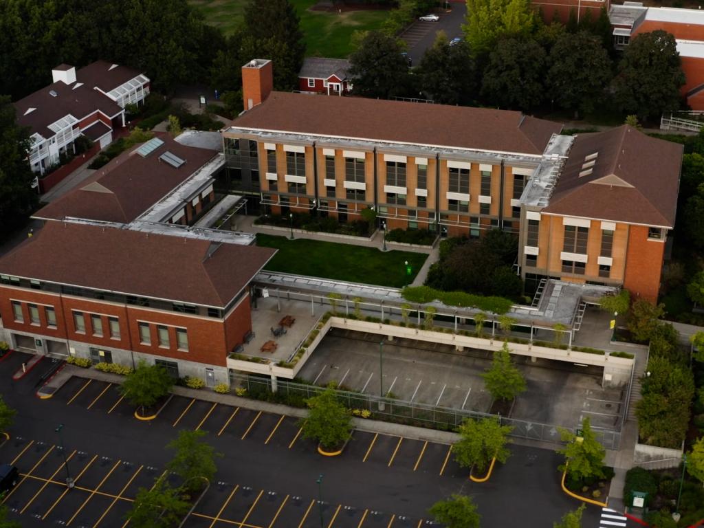 The red brick College of Education buildings at the University of Oregon seen from above.