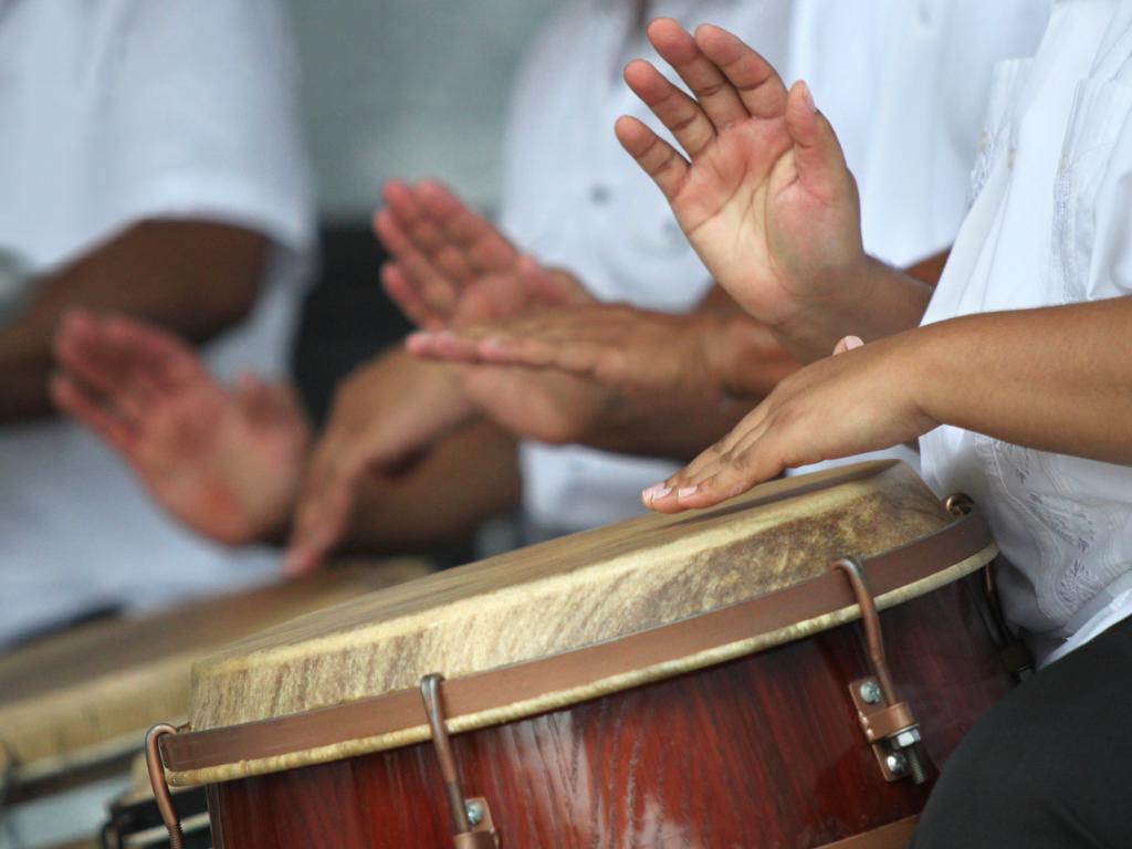 Hands playing a Puerto Rican bomba drum.