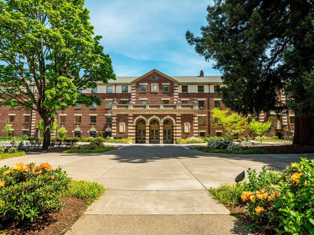 Exterior of a red brick building on a sunny spring day.