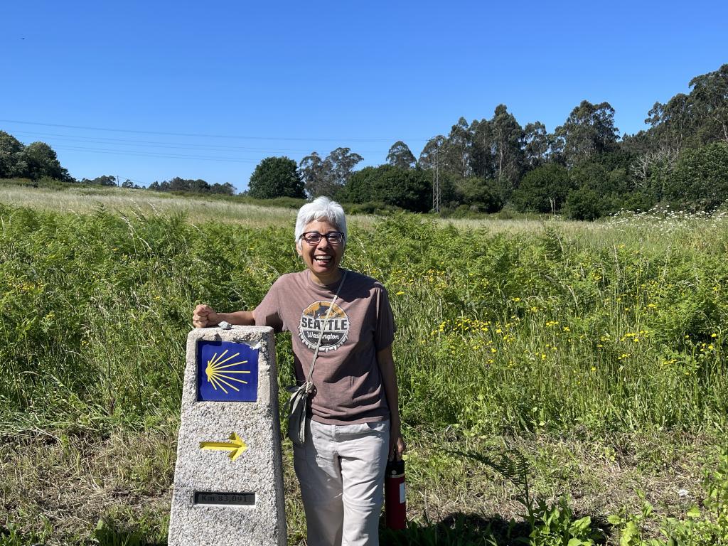 Laura Pulido stands next to a historical marker.
