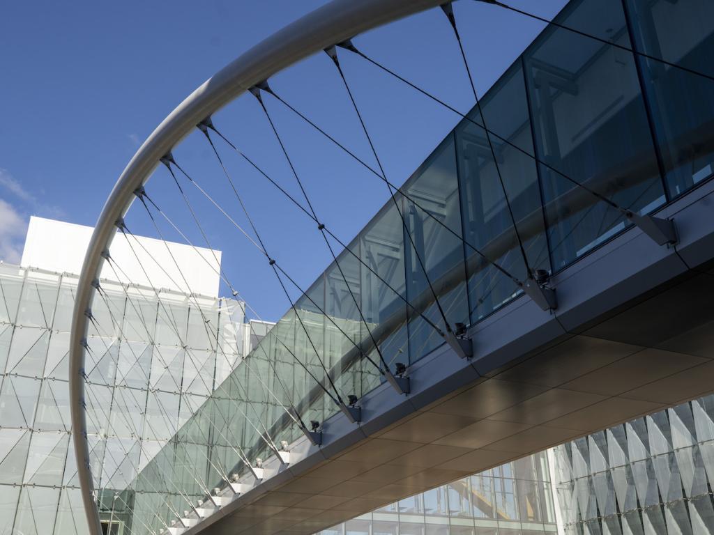 The bridge to the Knight Campus seen against the glass walls of the Knight Campus building.