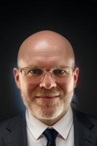 Headshot of Elliot Reed.