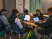 A group of students studying at a table.