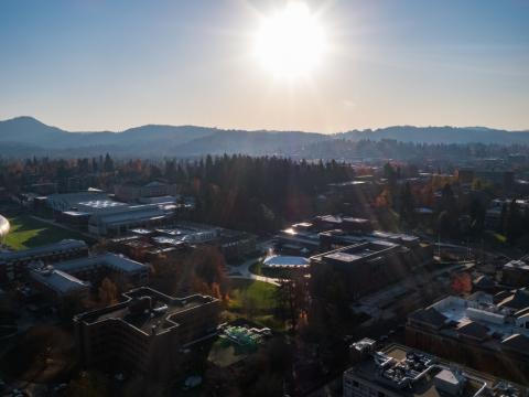 The sun rises over the University of Oregon campus.