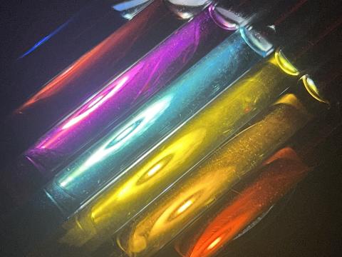 Brightly colored tubes in shades of blue, red, magenta, teal, yellow, orange,and red.