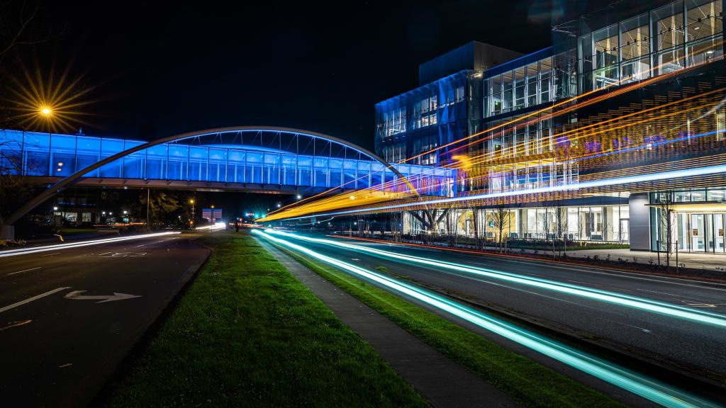 A nighttime image of the Phil and Penny Knight Campus building one.