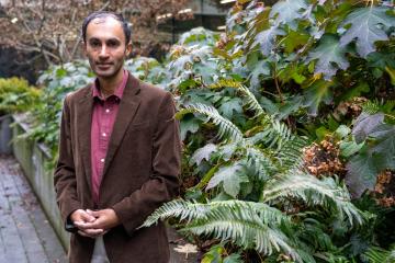 A portrait of Raghuveer Parthasarathy in a garden.